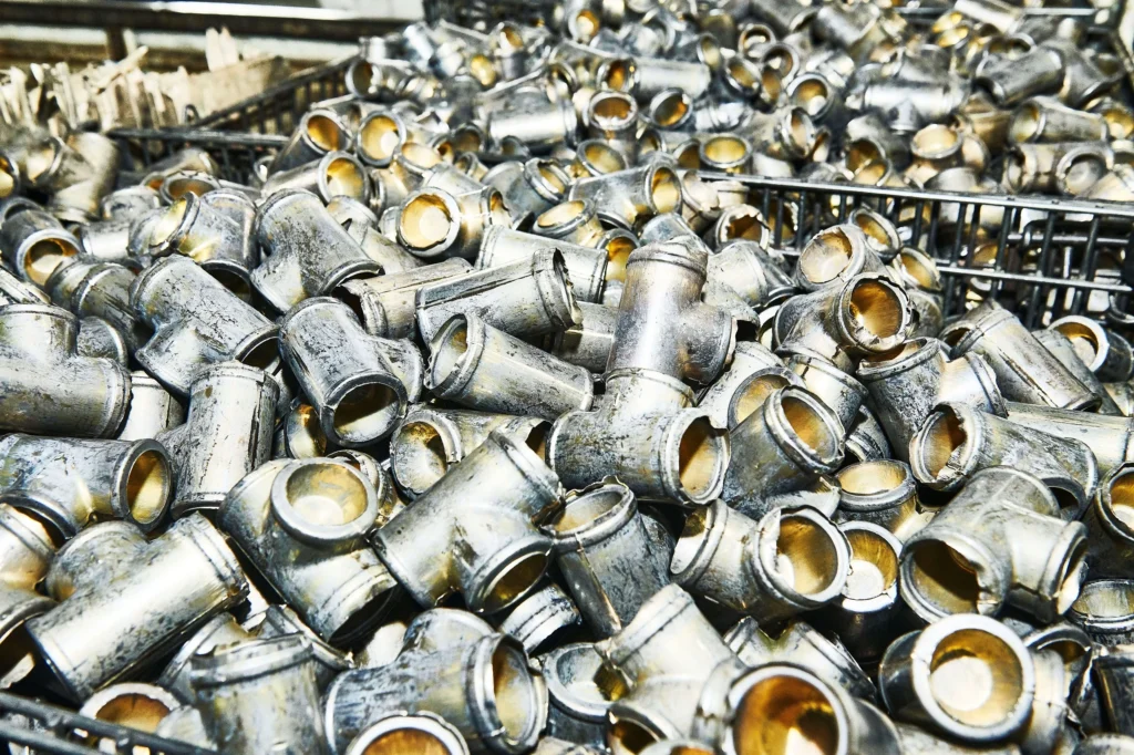Pile of raw metal fitting blanks